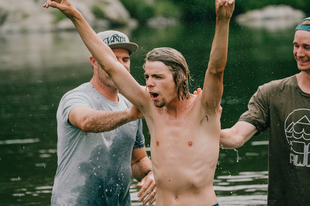 man soaked in wet in body of water