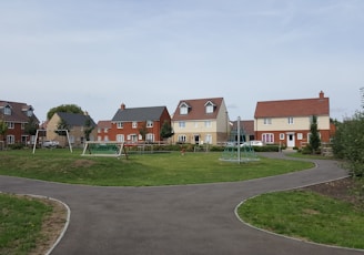 houses near play yard during daytime