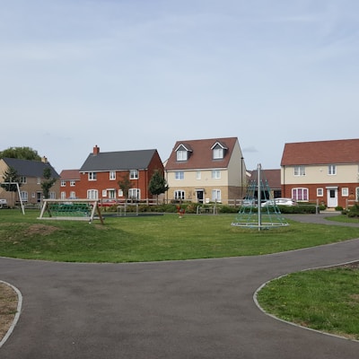 houses near play yard during daytime