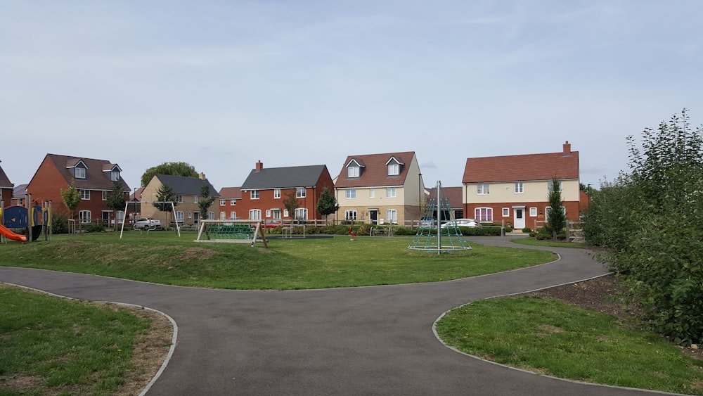 houses near play yard during daytime