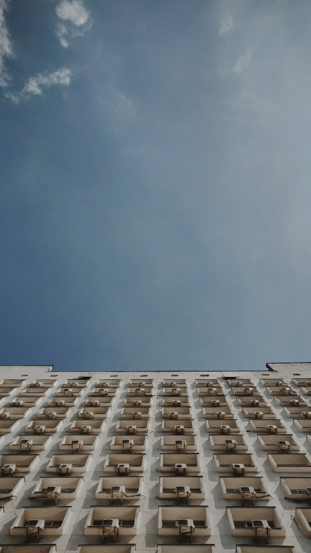 low angle photography of brown and white building