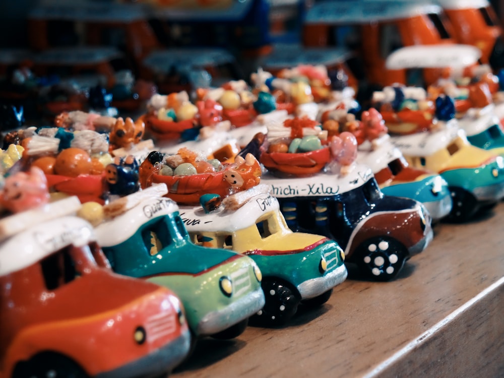 toy cars on wooden surface