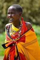 woman wearing yellow and red cape