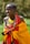 woman wearing yellow and red cape