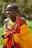 woman wearing yellow and red cape