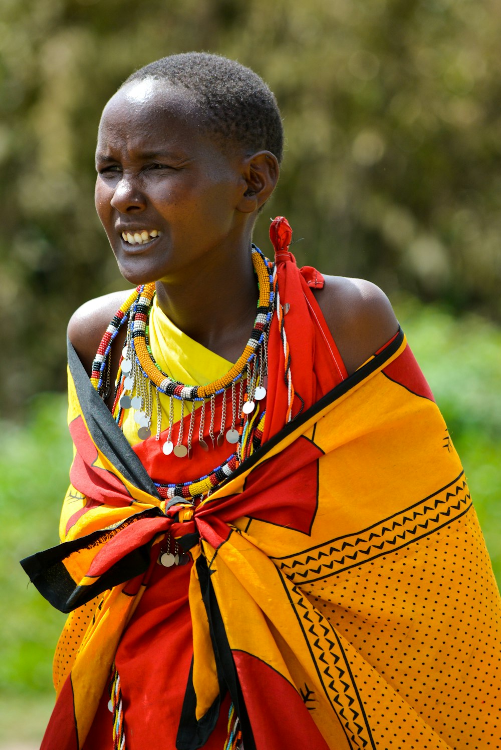 woman wearing yellow and red cape