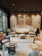 black metal framed beige padded sofa set inside room