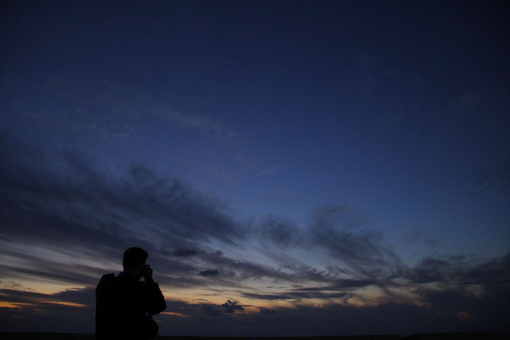 silhouette of man during dusk