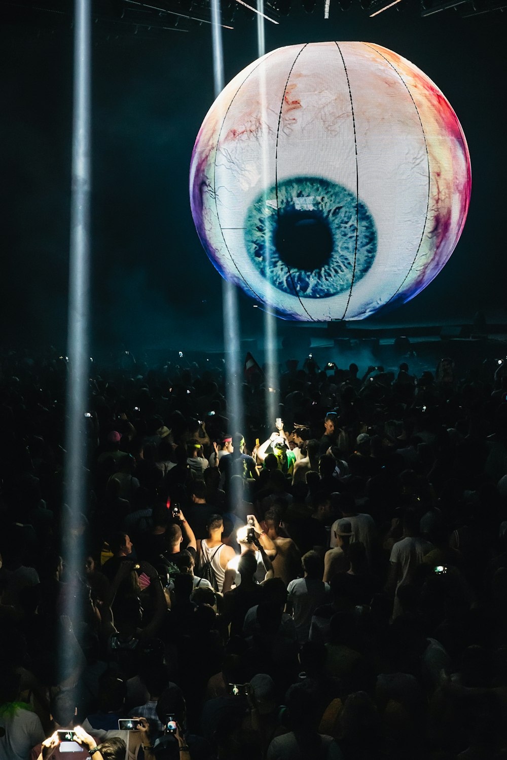 people gathering under white eye pendant light