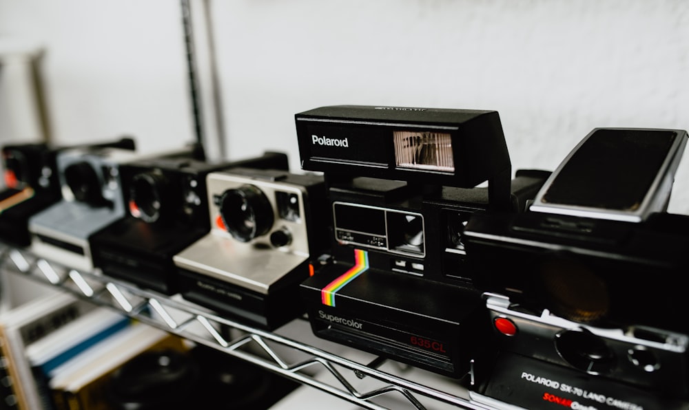 closeup photo of Polaroid cameras