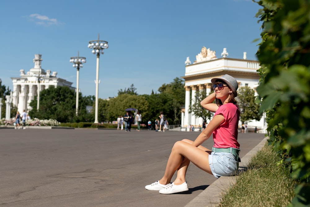 woman sitting near the road