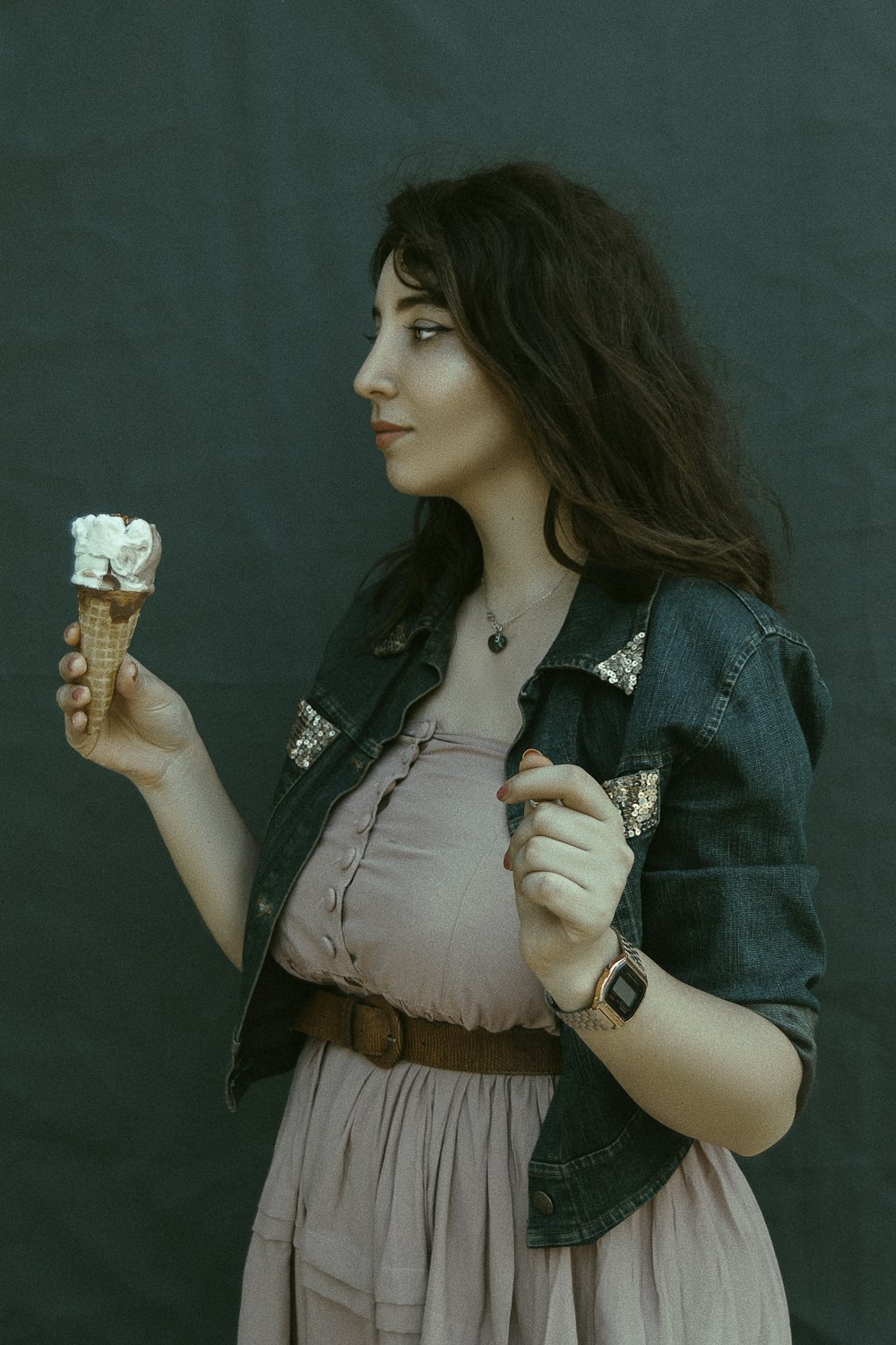 woman holding an ice cream cone on right hand