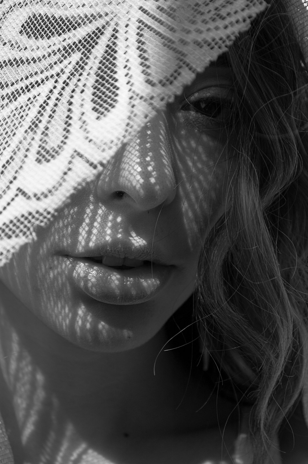 grayscale photo of woman in close up