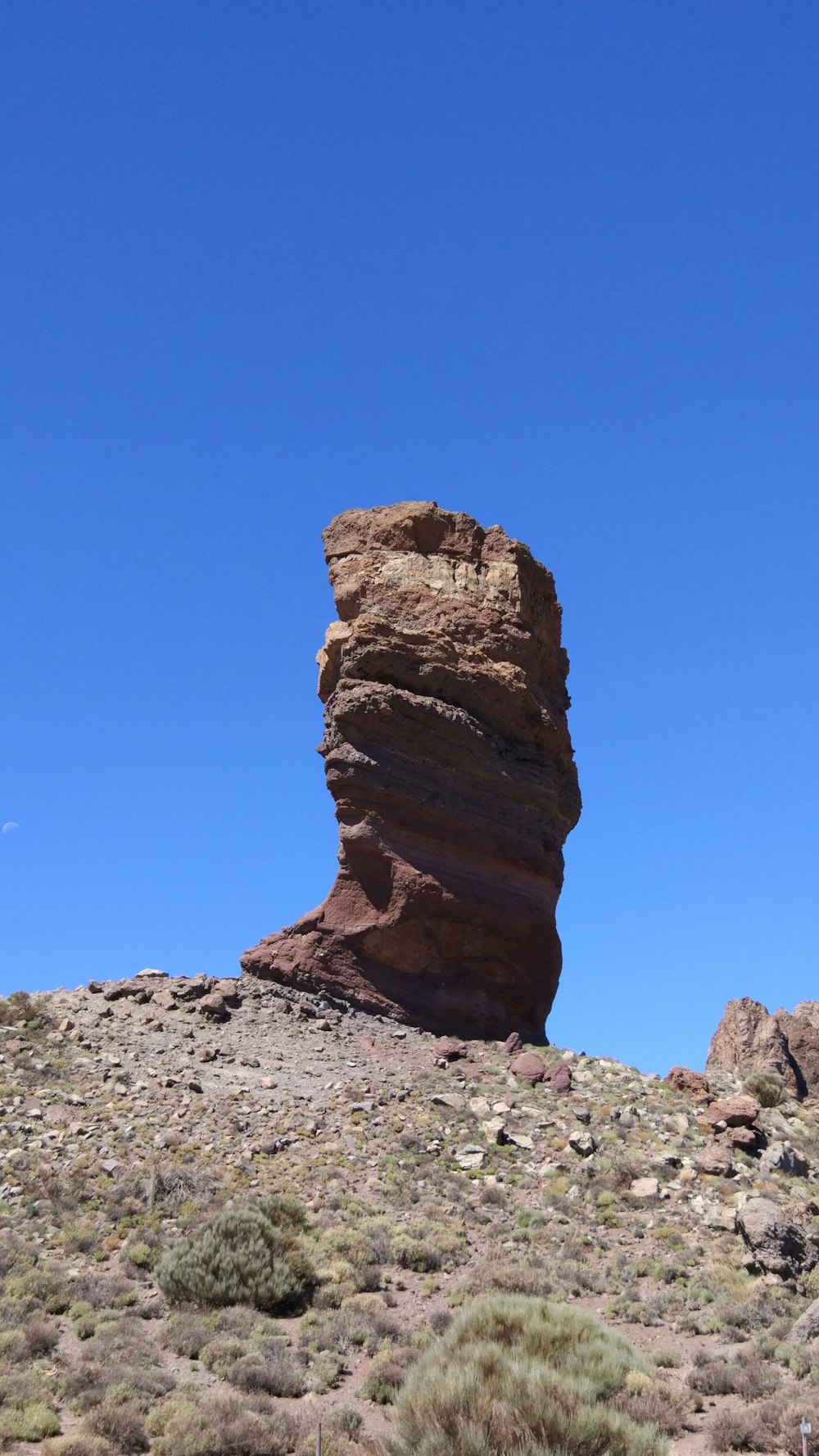 brown rock formation on hill