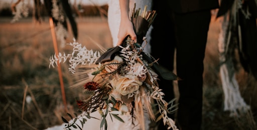 woman holding flower bouquet