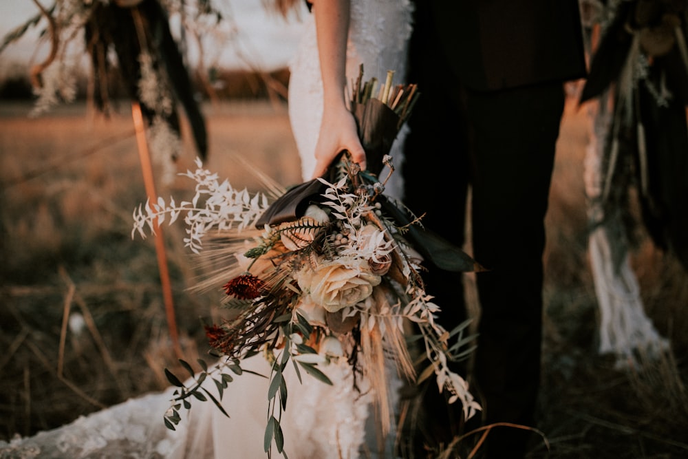 woman holding flower bouquet