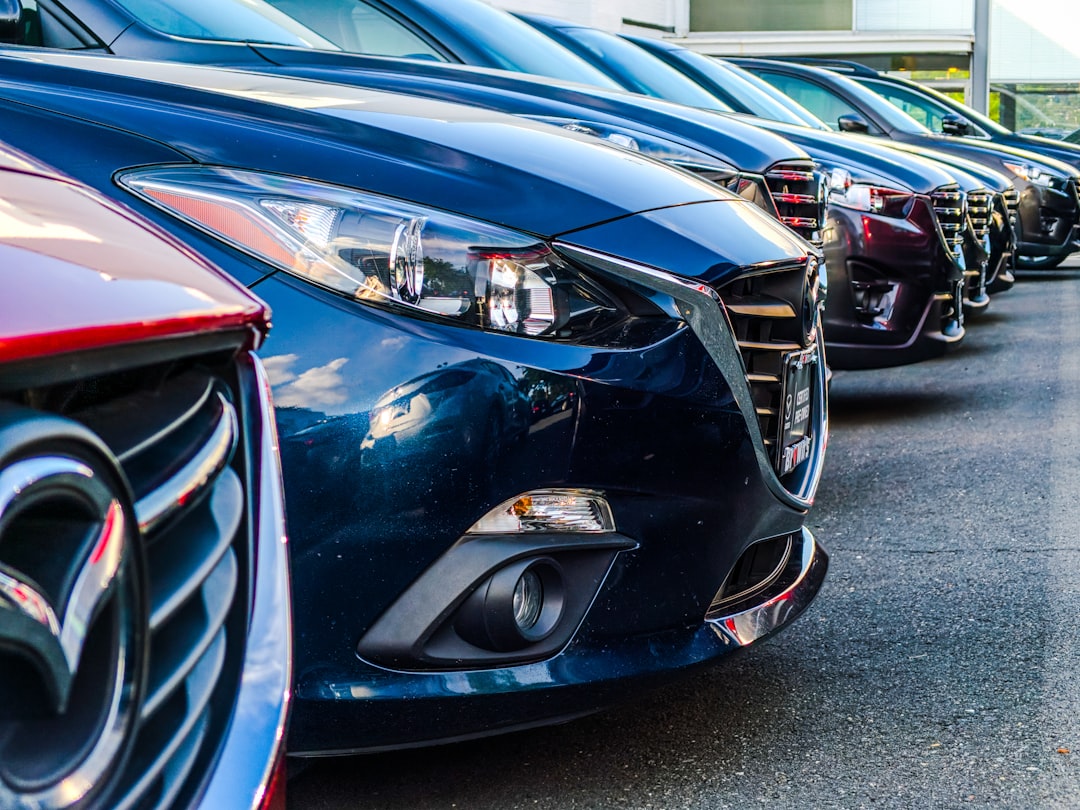 A row of Mazda 3s at a dealership in Fairfax VA