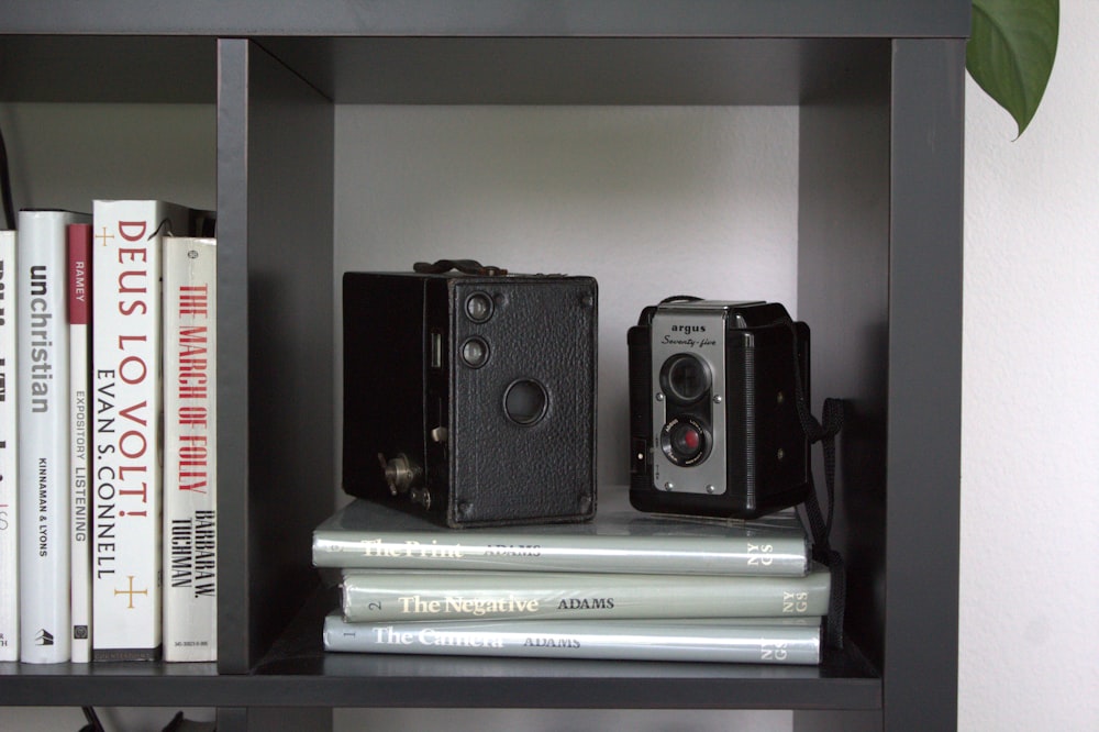 gray and black reel camera on rack