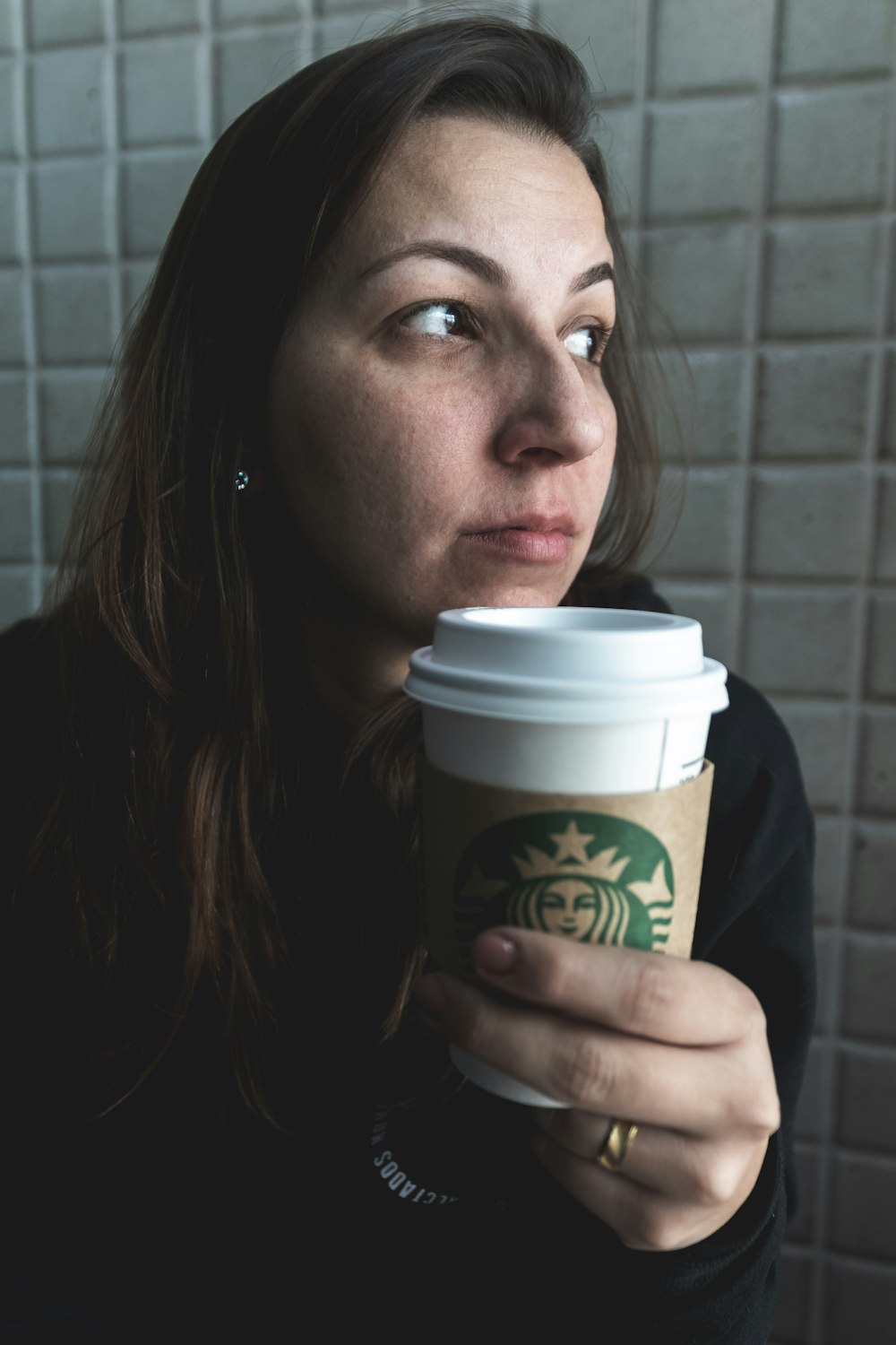 woman drinking Starbucks cup
