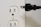 Close-up of a modern electrical outlet being installed by a skilled electrician.