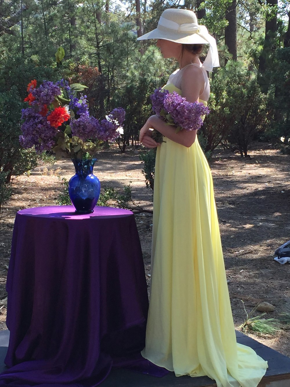 woman standing in front of flower vase