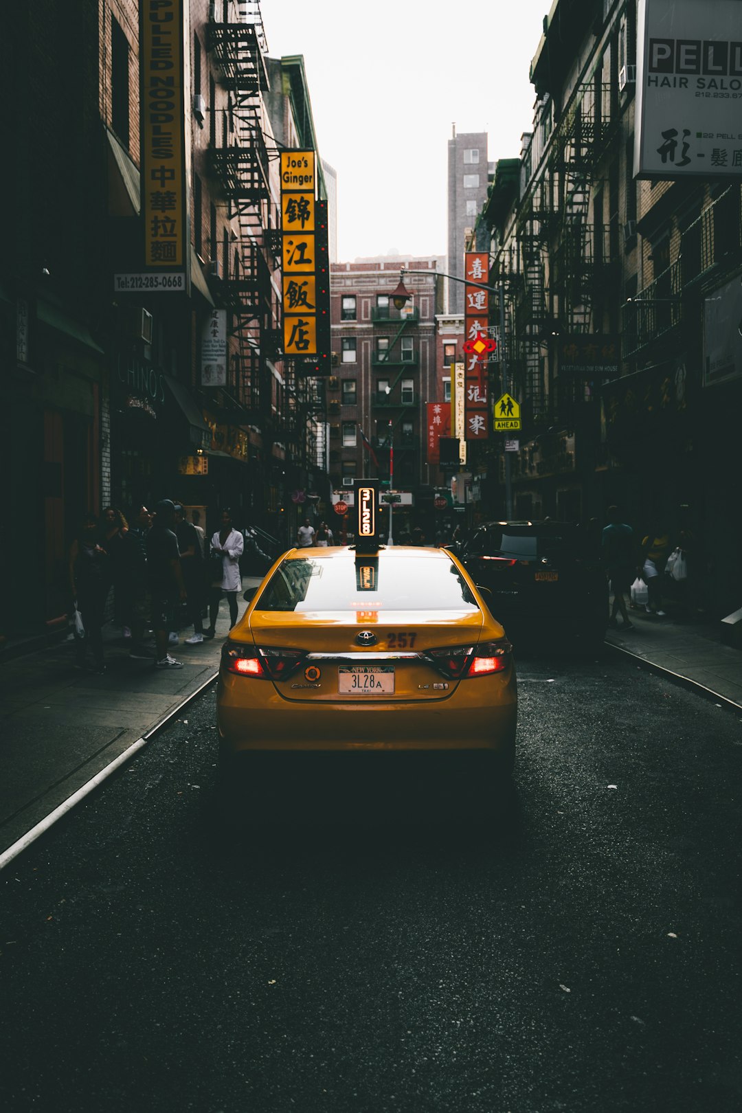 yellow car on road