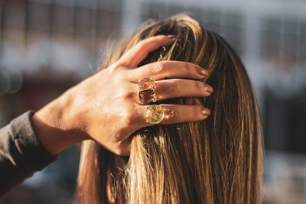 brunette woman holding her hair