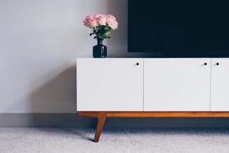 An elegant cabinet in a minimalist setting.