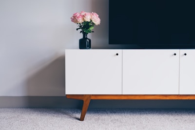 An elegant cabinet in a minimalist setting.