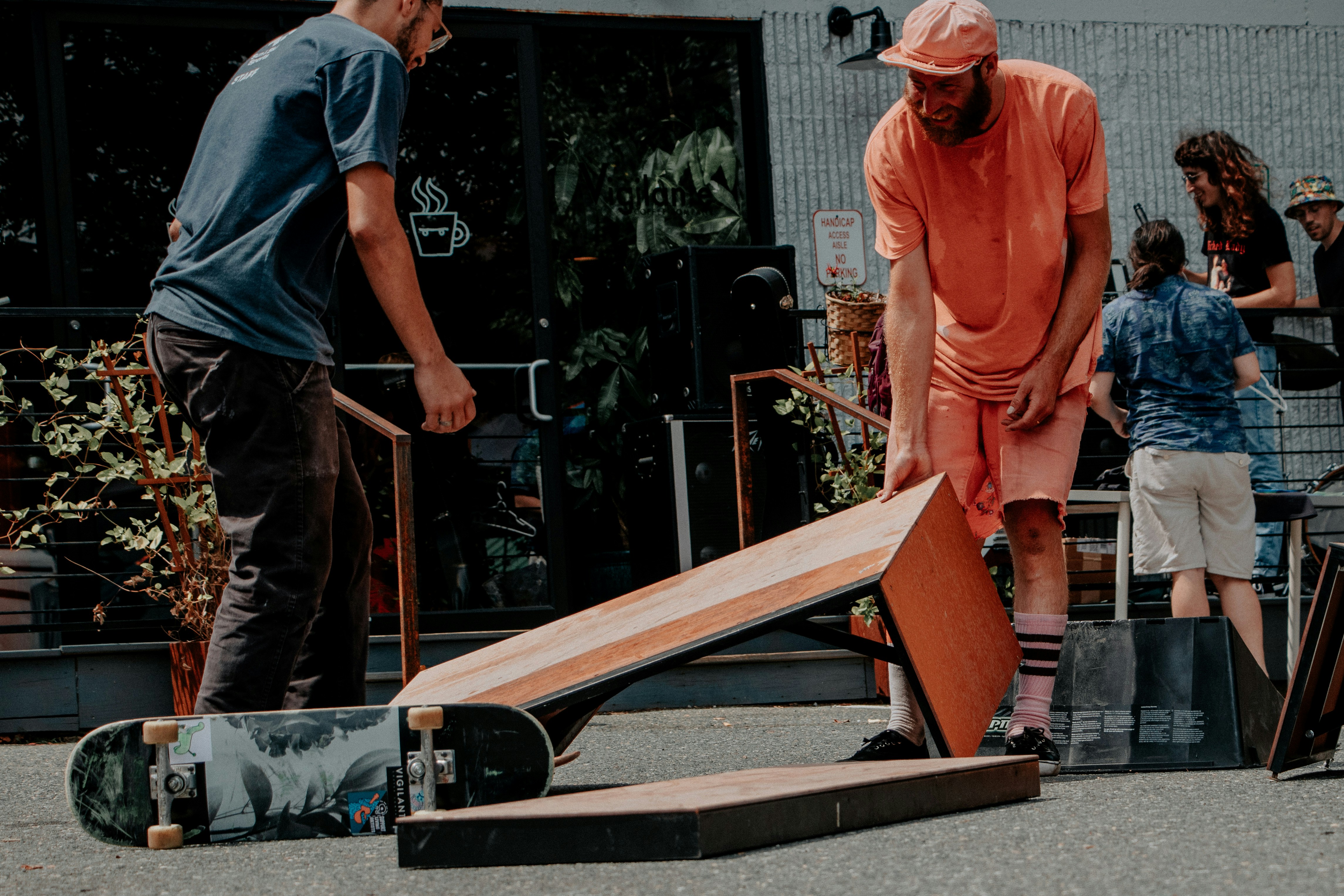 man in orange short-sleeved shirt