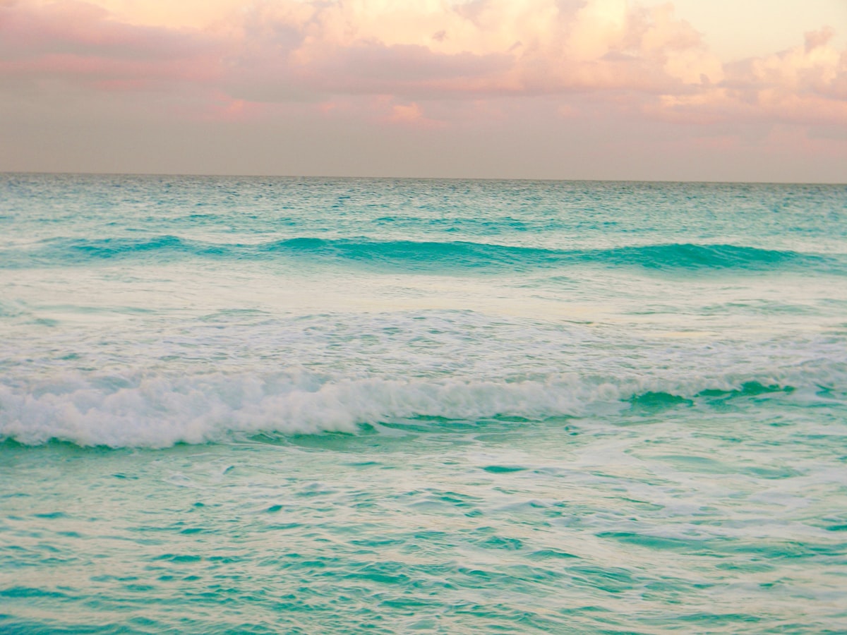 Cancun May — turquoise Caribbean waves on the Cancun coast in the shoulder season