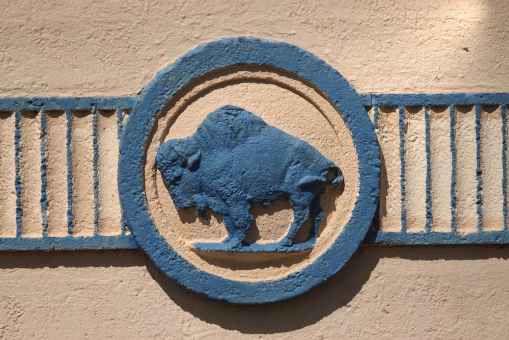 a blue bull emblem on the side of a building