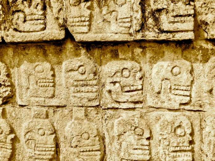 Beyond Chichen Itza - Hidden Mayan Ruins in Mexico mayan skull embossed on concrete
