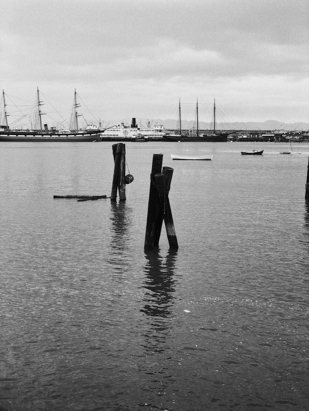 grayscale photo of ships on body of water