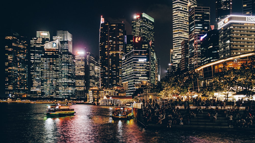 lighted high-rise buildings facing ocean