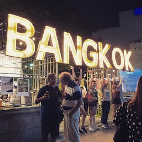 turned-on yellow Bangkok signage