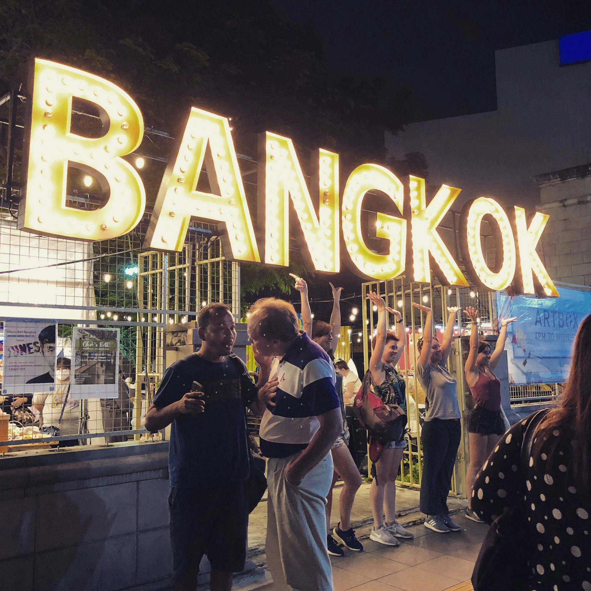 turned-on yellow Bangkok signage