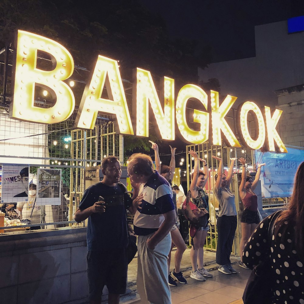 turned-on yellow Bangkok signage
