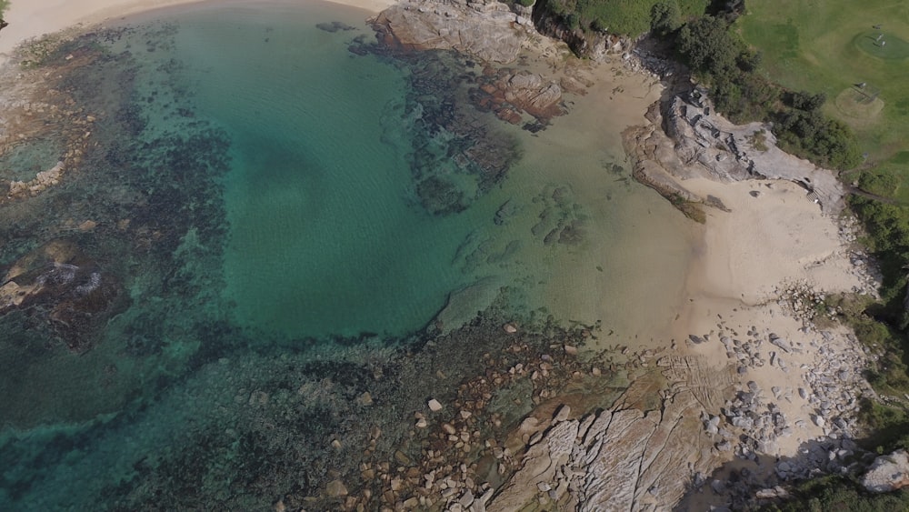 an aerial view of a beach and a body of water