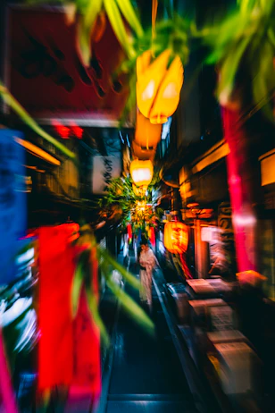 a blurry photo of a city street at night