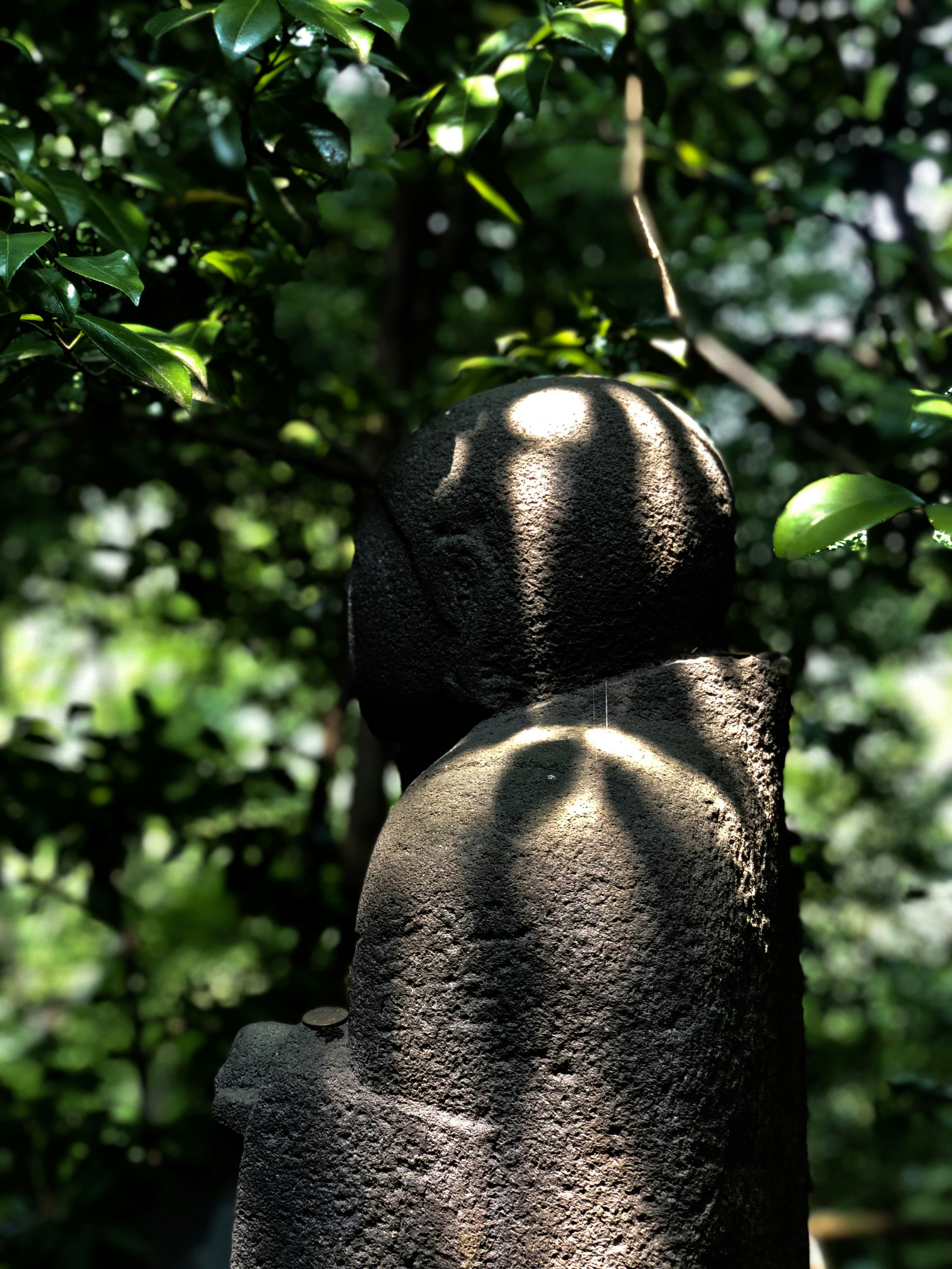 gray stone statuette