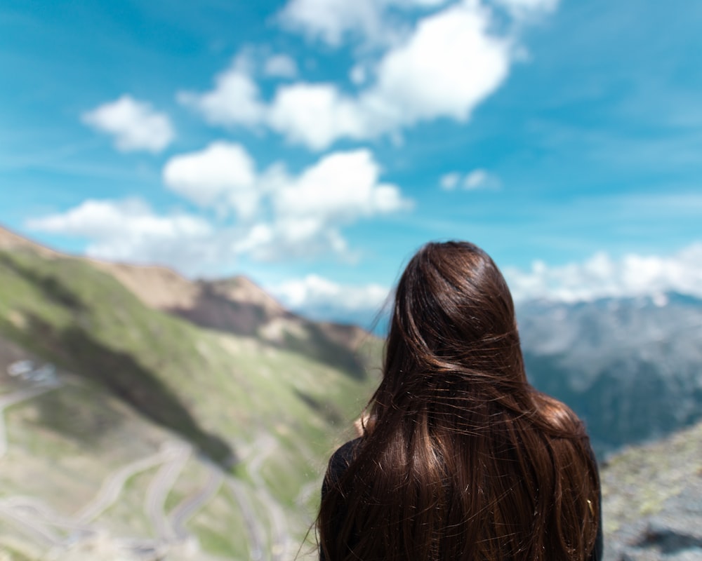 women near mountains during daytime