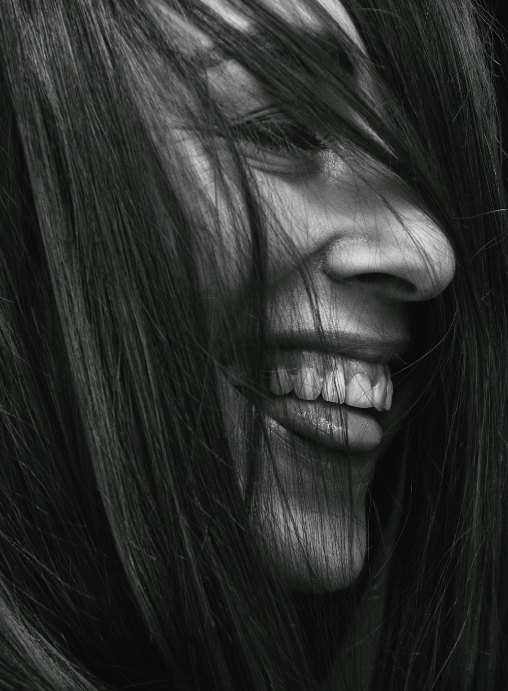 grayscale photography of smiling woman