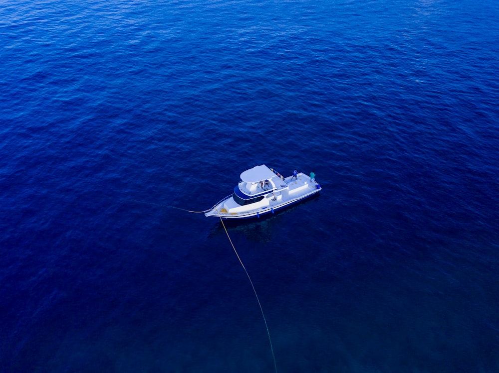 aerial photo of boat on ocean during daytime