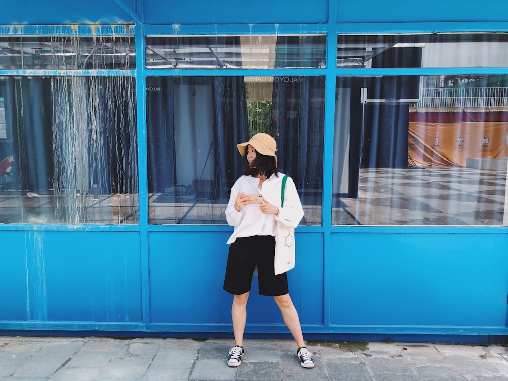 women's white long-sleeved blouse and black shorts