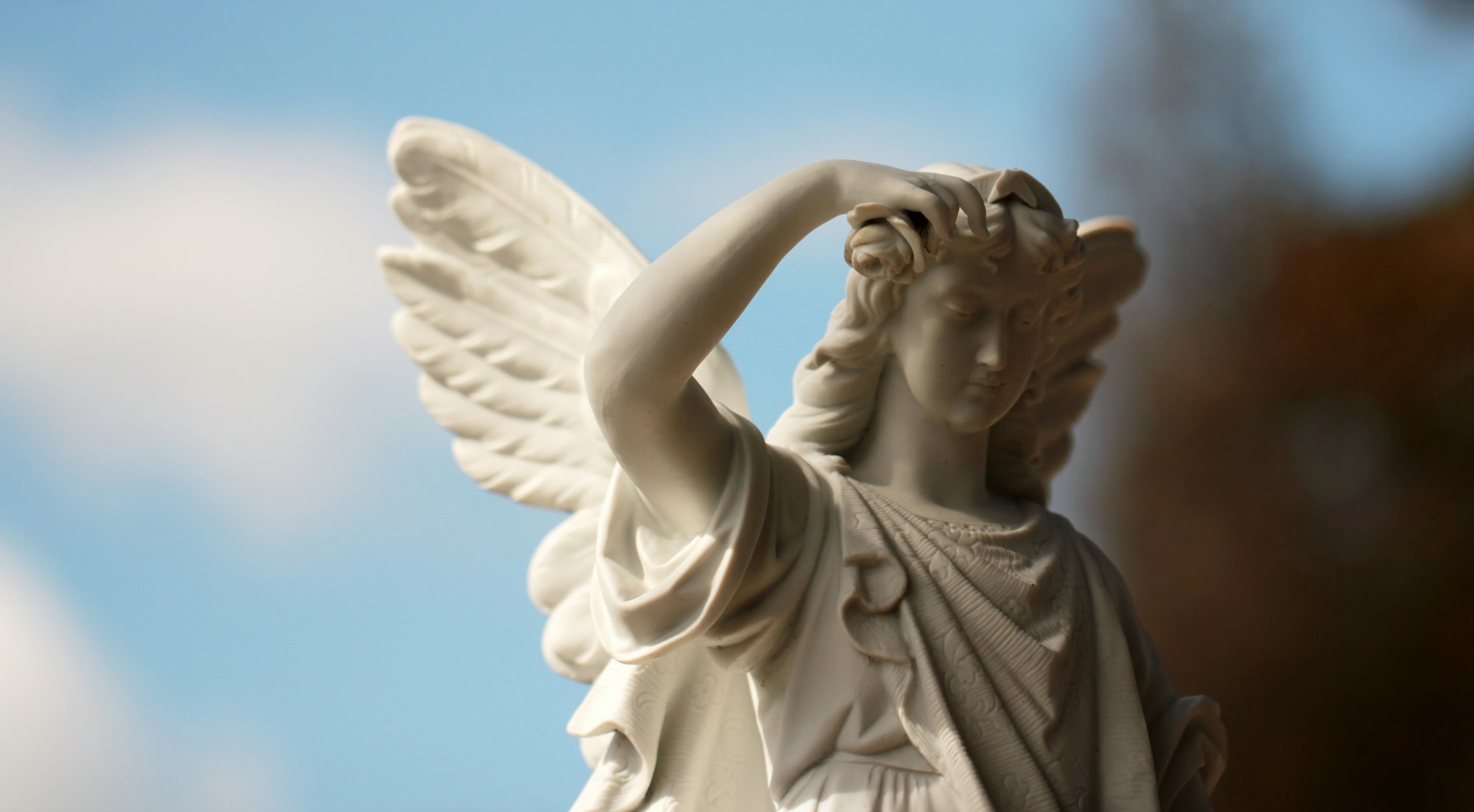 An angel in a cemetery, weathered by time, but still a powerful image