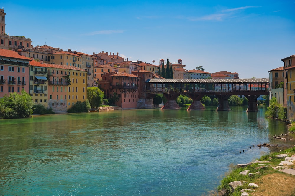 body of water surrounded with buildings at daytime