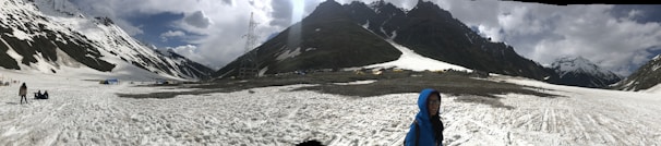 A panoramic shot of Malamjaba’s snow-capped peaks with skiers and hikers exploring the slopes.