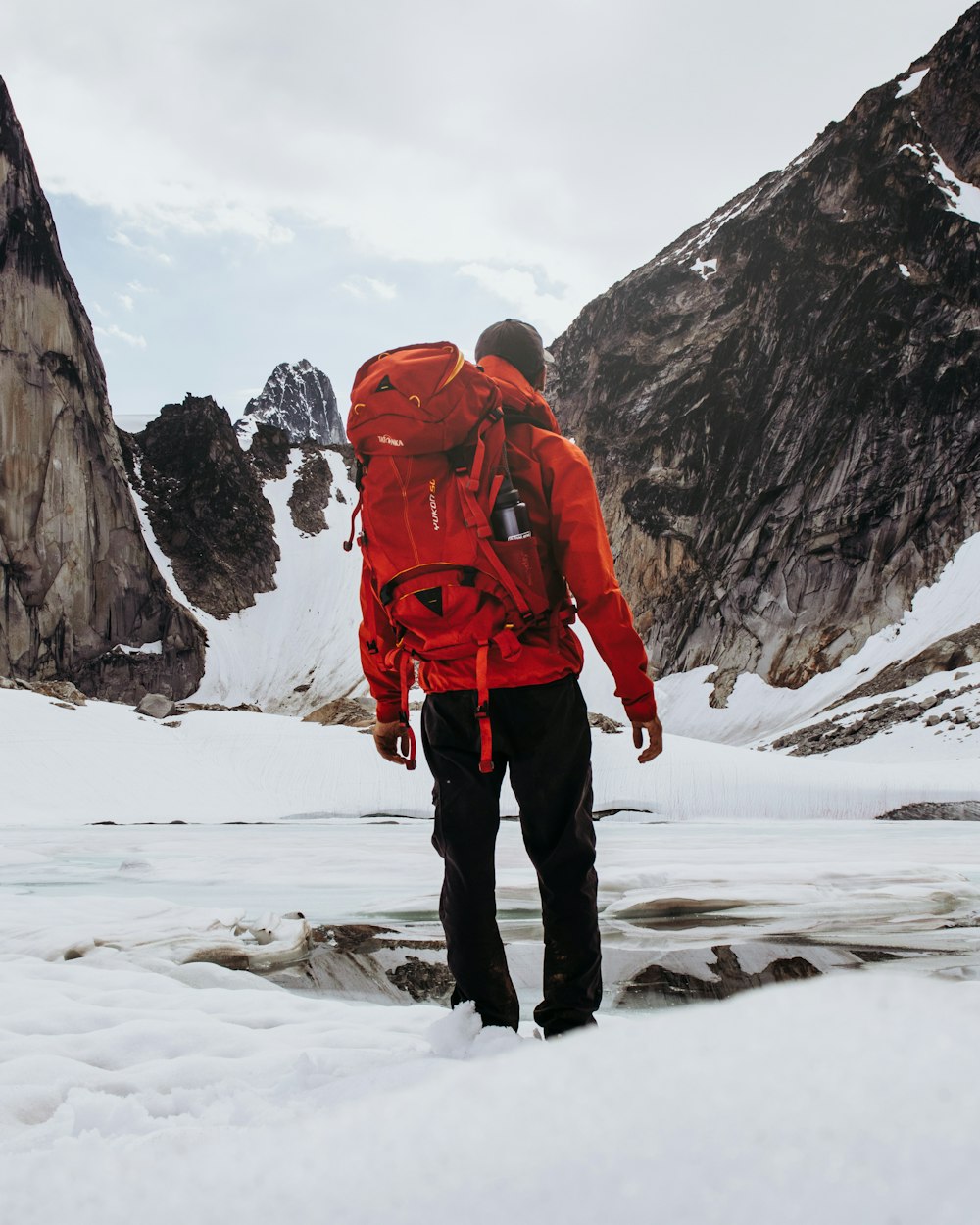 man carrying hiking backpack