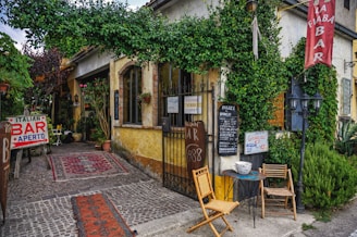 An inviting outdoor terrace of a local Milanese café ideal for aperitivo.